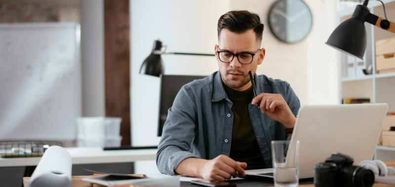 A man at a desk organising his thoughts