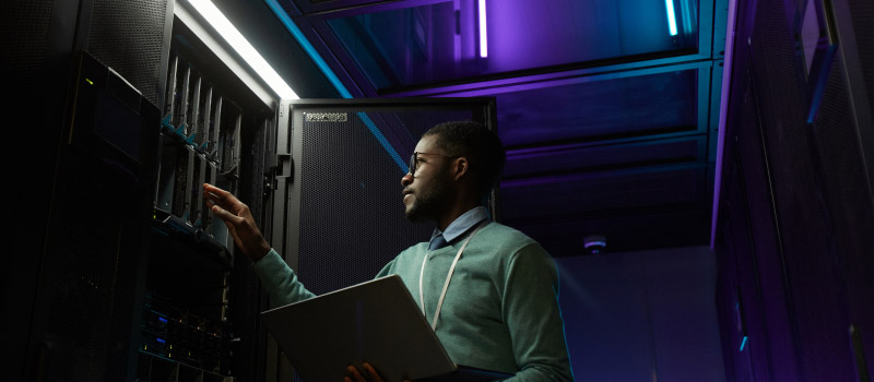 Engineer checking a rack in a data centre