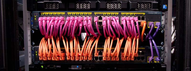 Pink and Orange network cables in a switch