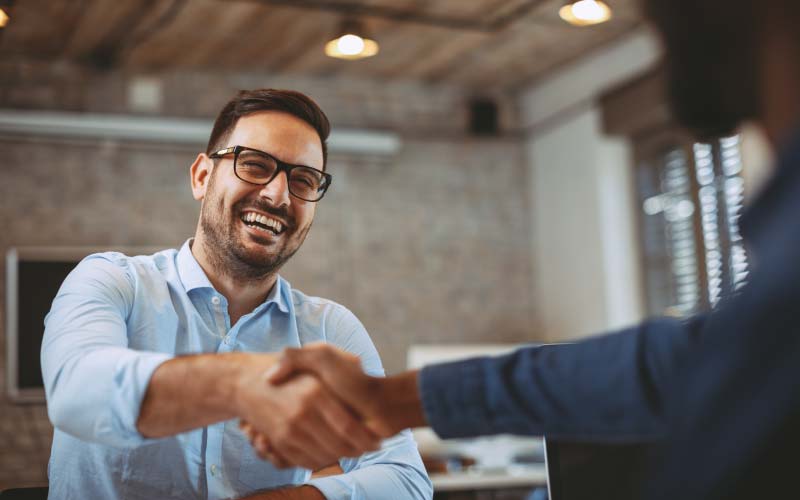 Two business people shaking hands